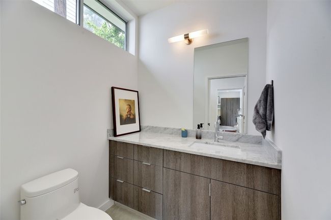 Half bath featuring toilet and vanity | Image 10