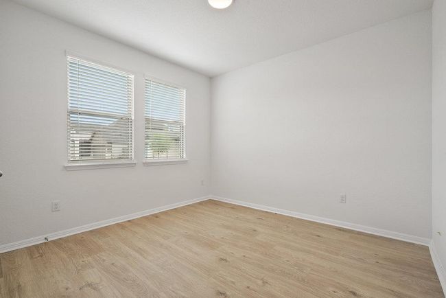 Unfurnished room featuring light wood-style flooring and baseboards | Image 10