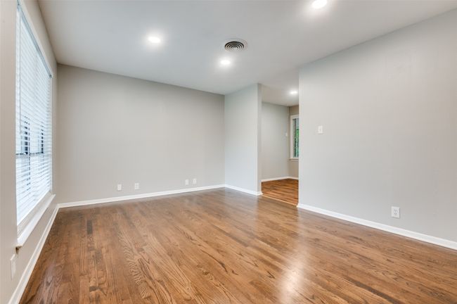 Livingroom featuring real wood finished floors, recessed lighting, and baseboards | Image 5