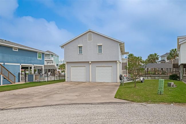 Spacious driveway and a canal view. | Image 4
