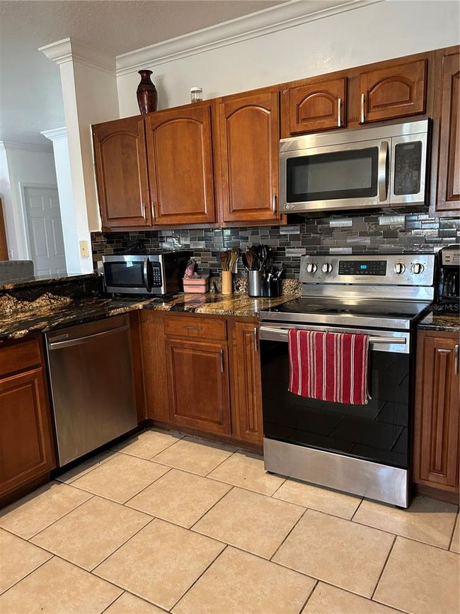 5406 Crepe Myrtle Cir, House other with 4 bedrooms, 3 bathrooms and null parking in KISSIMMEE FL | Image 23