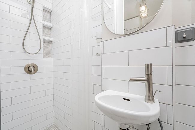 Bathroom featuring a tile shower | Image 19