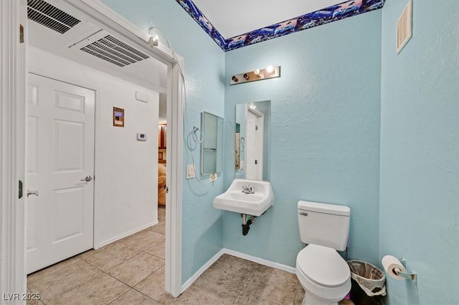 Full bath featuring tile patterned floors and toilet | Image 16