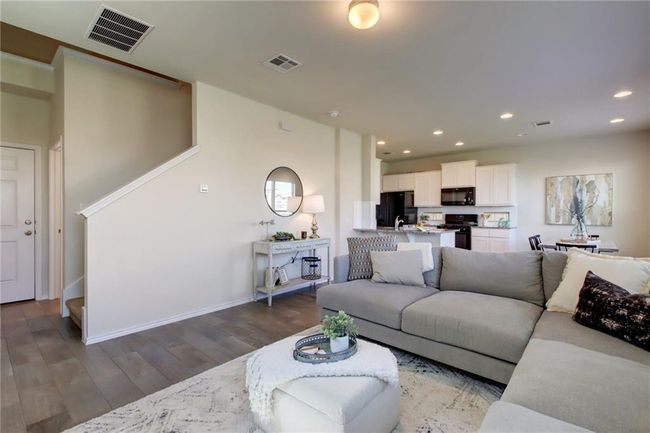 Living room with light wood-style floors and recessed lighting | Image 5
