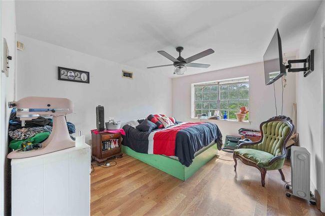 1 of the 2 upstairs bedrooms. This room offers 2 walk in closets. | Image 18