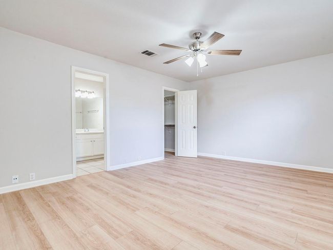 Unfurnished room with ceiling fan and light wood-style floors | Image 17