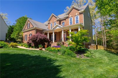 Craftsman-style home with a porch and a front yard | Image 2