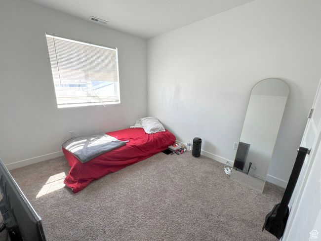 Bedroom featuring carpet and baseboards | Image 7