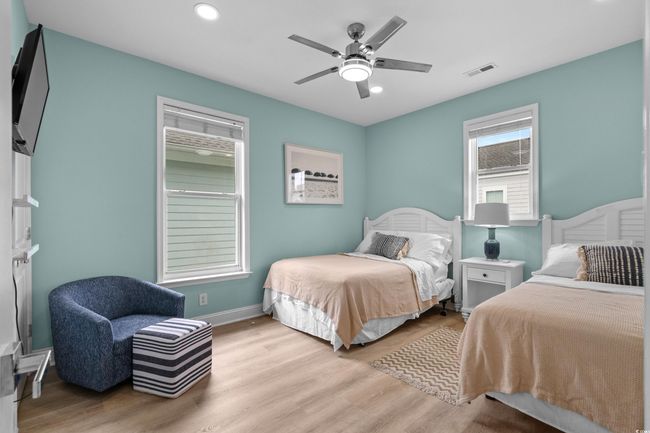 Bedroom with visible vents, recessed lighting, and light wood-style floors | Image 24