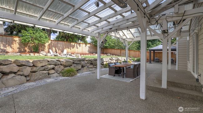 Take in the full view of this tranquil covered area, all set and ready for you! | Image 36