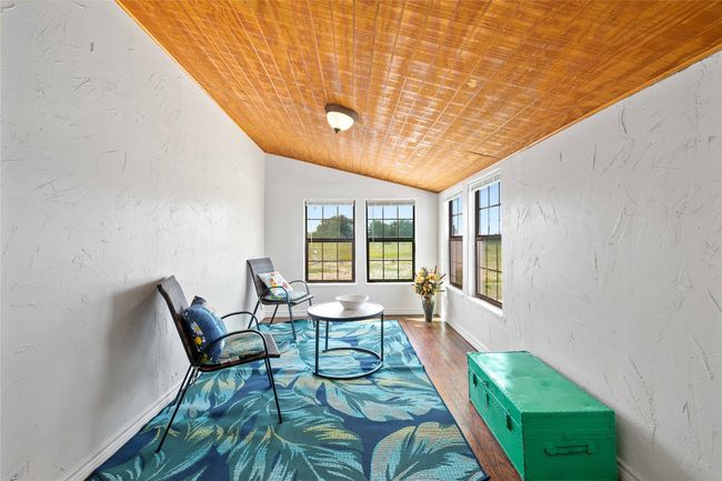 Sunroom featuring lofted ceiling | Image 21