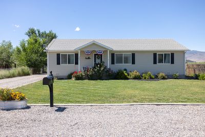 Ranch-style house featuring a front yard | Image 1