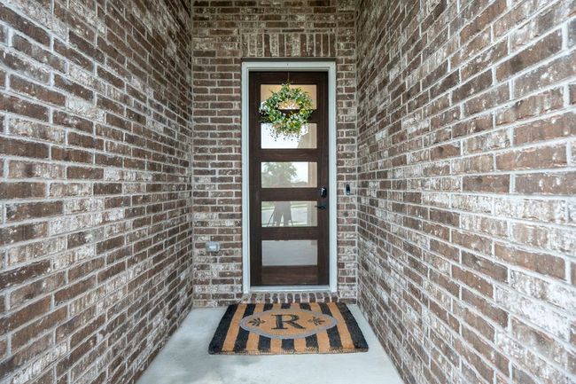 Welcoming exterior entry with 8ft gorgeous front door. | Image 36