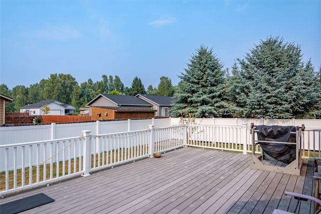 Deck with a fenced backyard | Image 32