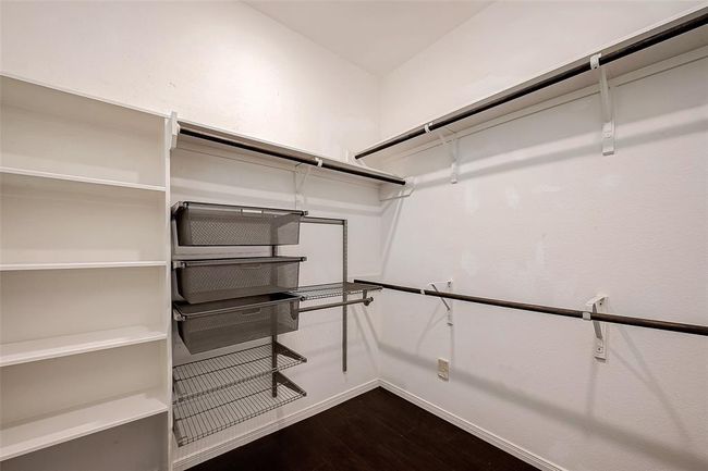 Huge walk in closet with plenty of built in shelving | Image 22
