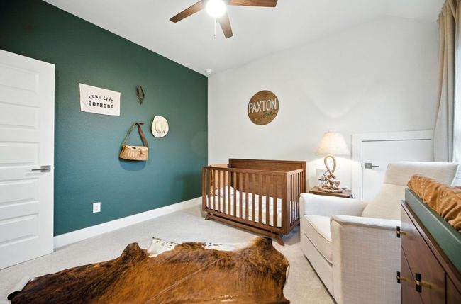Upstairs Bedroom featuring carpet, vaulted ceiling, and a ceiling fan | Image 31