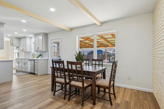 Dining space with plenty of natural light, beam ceiling, light wood-type flooring, baseboards, and recessed lighting | Image 6