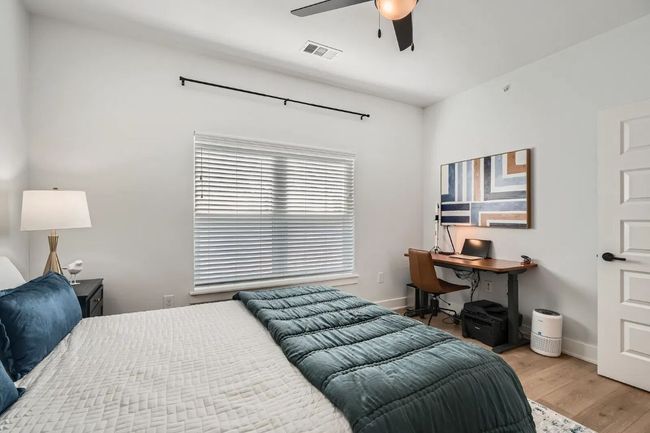 Master Bedroom with light wood-style flooring, a ceiling fan, and a desk | Image 10