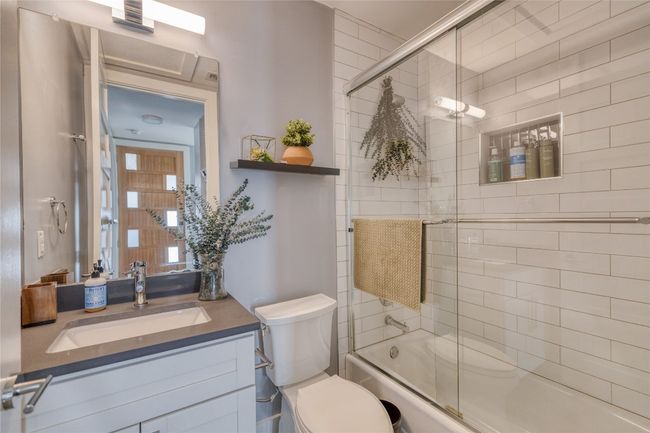 Full bath with toilet, vanity, and combined bath / shower with glass door | Image 14