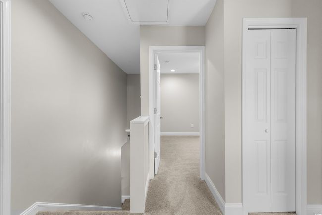 Corridor with an upstairs landing, baseboards, and carpet flooring | Image 22