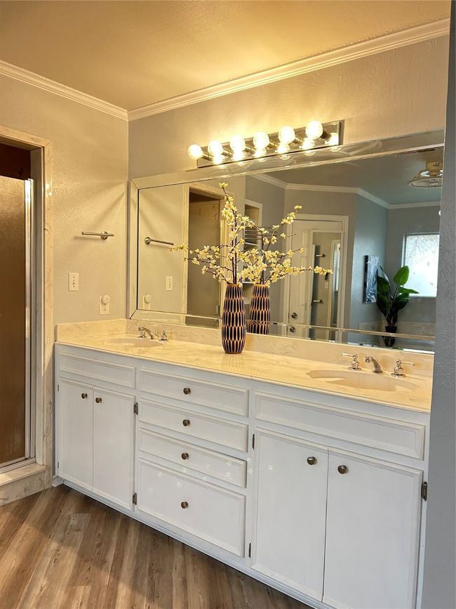 Full bath featuring a sink, wood finished floors, and ornamental molding | Image 30