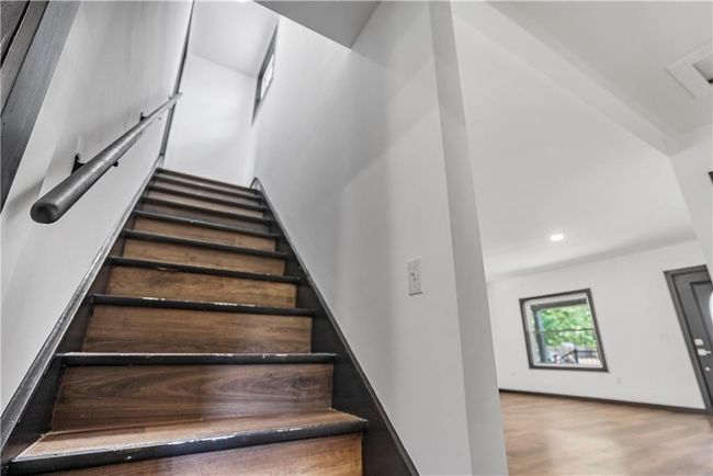 Stairway leading to bedroom with wood finished floors and recessed lighting | Image 36
