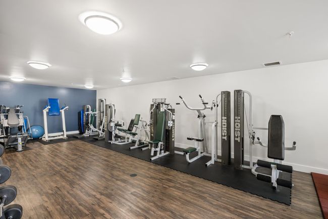 Gym with baseboards and wood finished floors | Image 31