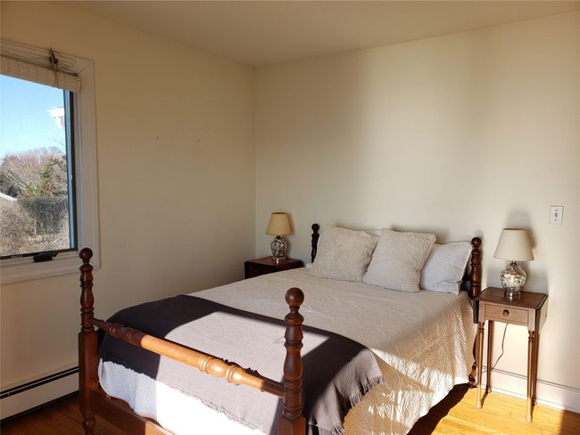 Guest Bedroom has door to balcony and waterview on 2 sides | Image 39