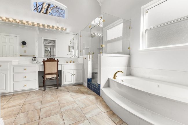 Full bathroom with a shower stall, jetted bathtub, and vanity | Image 20