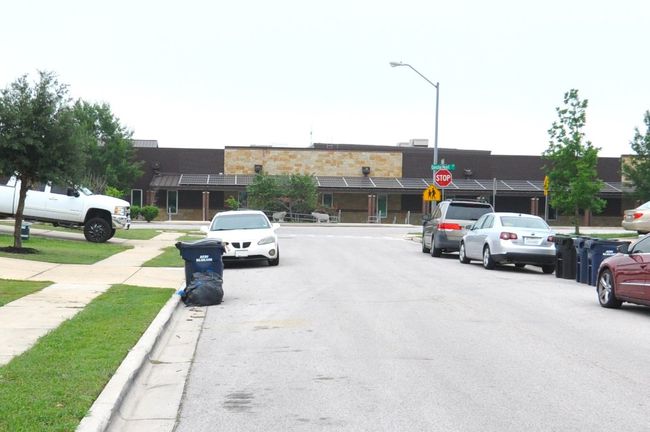 View of road with sidewalks, curbs, street lighting, and traffic signs | Image 22