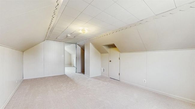 Upstairs, you’ll find a spacious bedroom with a walk-in closet and brand-new carpet. | Image 11