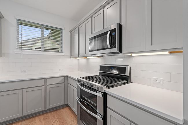 Plenty of counter space, cabinets and natural lighting throughout. | Image 9