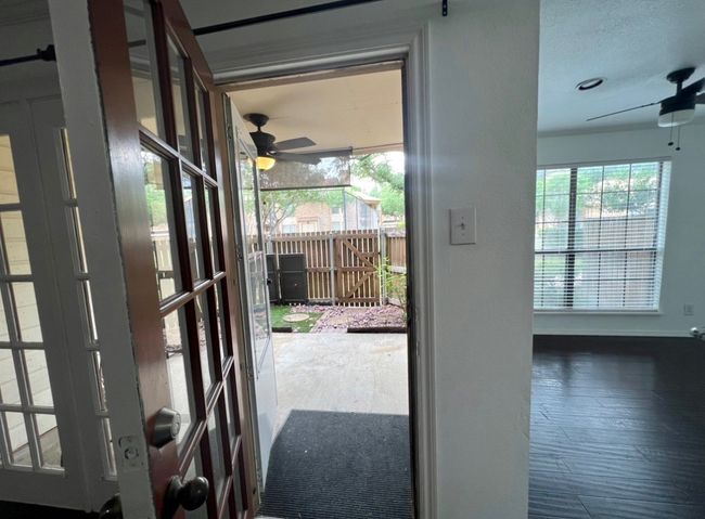 Doorway featuring a ceiling fan and plenty of natural light | Image 20