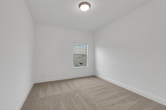 Carpeted spare room with baseboards | Image 36
