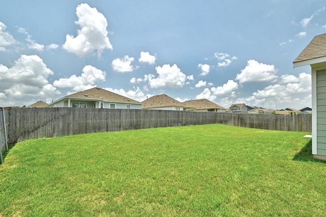 View of yard with a residential view | Image 25