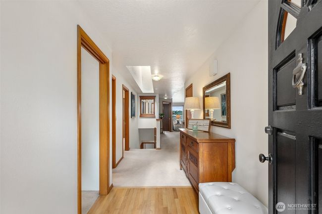 Welcoming entry with warm hardwood flooring. Office to the left in this photo, dining and living toward the view! | Image 7