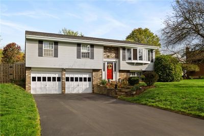 BEAUTIFULLY MAINTAINED~OVERSIZED 2 CAR GARAGE (WITH NO POLE IN THE MIDDLE!!)~FENCE ON LEFT LEADS TO THE PRIVATE BACKYARD | Image 2