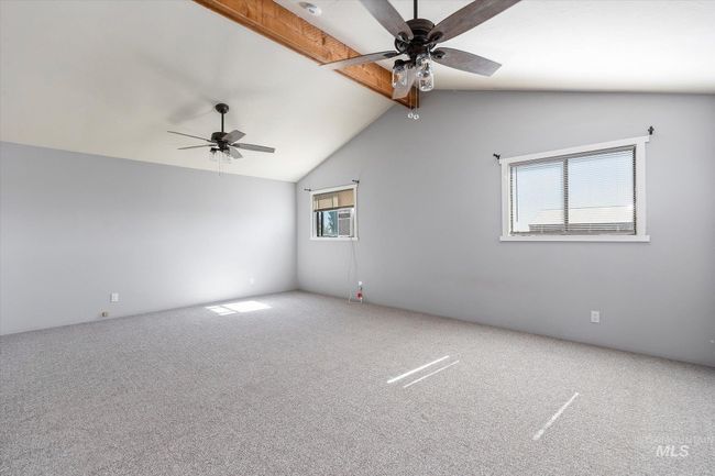 Unfurnished room featuring ceiling fan and carpet | Image 18