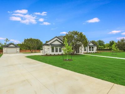 Welcome to 112 Tesoro Perdido Cove! This stunning newly built custom home is situated on an extra large 1.89 acre lot in a quiet cul-de-sac location of the Tesoro Subdivision in Liberty Hill! Fully landscaped and irrigated in the front, sides and partial rear. All sides masonry, full seamless metal rain gutters, and partially fenced. 3-Car attached garage with a 20'x 30' detached garage/workshop! | Image 3