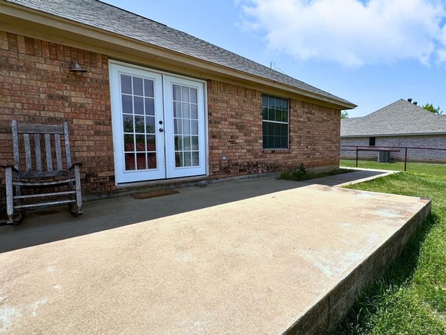 Double doors open to expansive yard and patio | Image 28