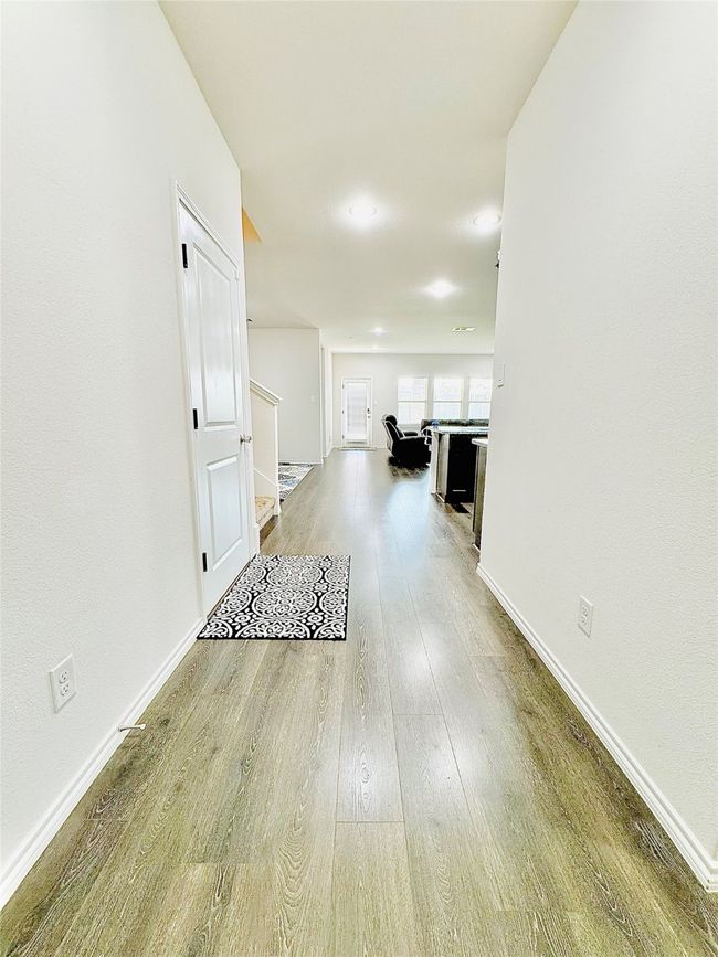 Corridor with wood finished floors and baseboards | Image 6