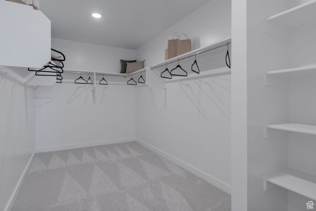Spacious closet with carpet flooring | Image 9