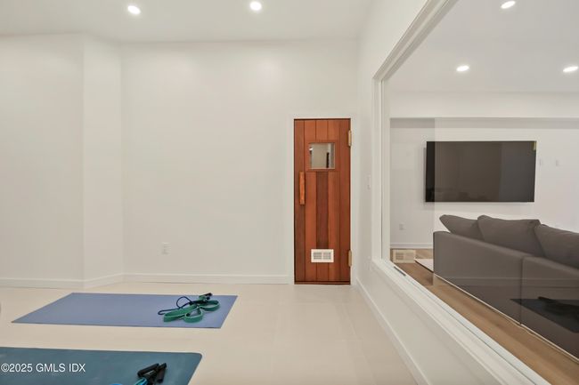 Yoga Room and Sauna in Lower Level w glass wall to entertainment area | Image 35