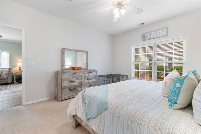 Carpeted bedroom featuring baseboards and ceiling fan | Image 15