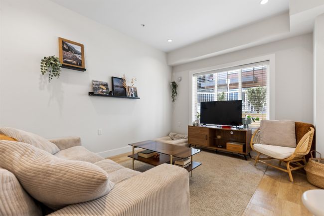 Living room with recessed lighting, light wood finished floors, and baseboards | Image 8