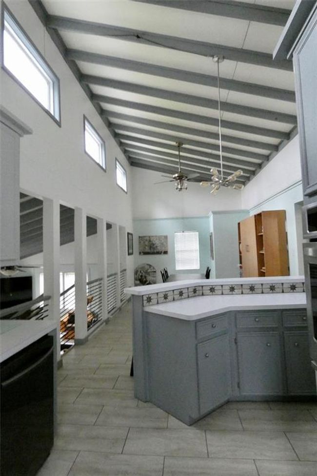Breakfast bar and dining room, vaulted ceiling and windows | Image 11