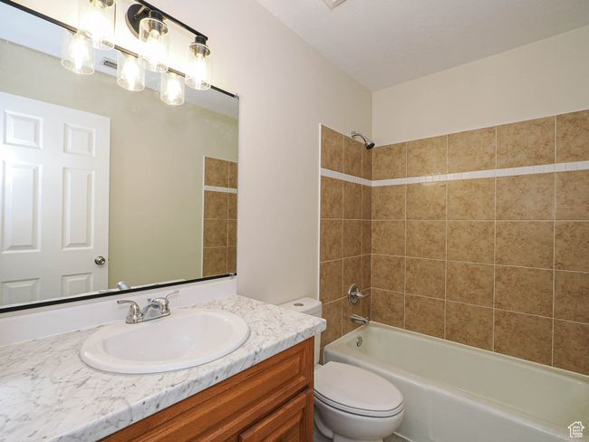 Full bathroom featuring vanity and bathtub / shower combination | Image 46