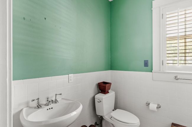 Half bathroom with tile walls and a wainscoted wall | Image 20