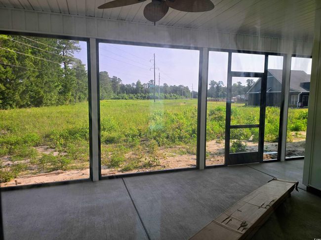 View of unfurnished sunroom | Image 15