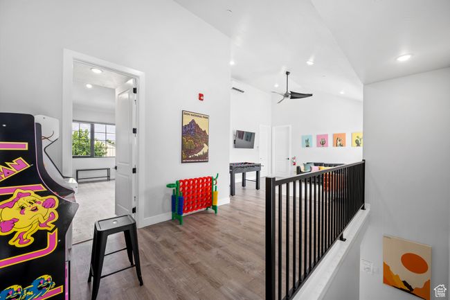 Corridor featuring light hardwood / wood-style floors and vaulted ceiling | Image 18